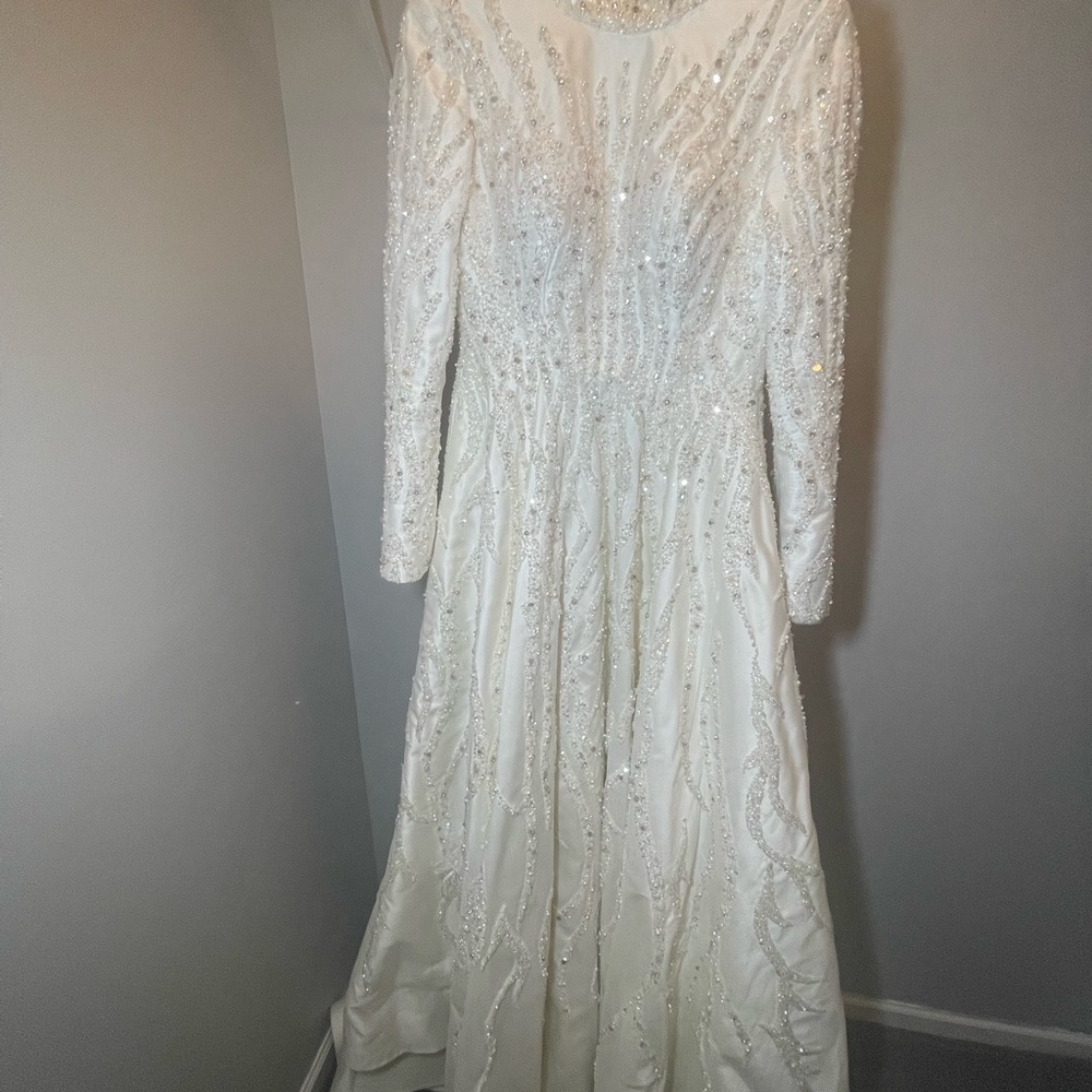 Wedding dress is from Turkey. I’ll sent you with veil. It is a custom design.